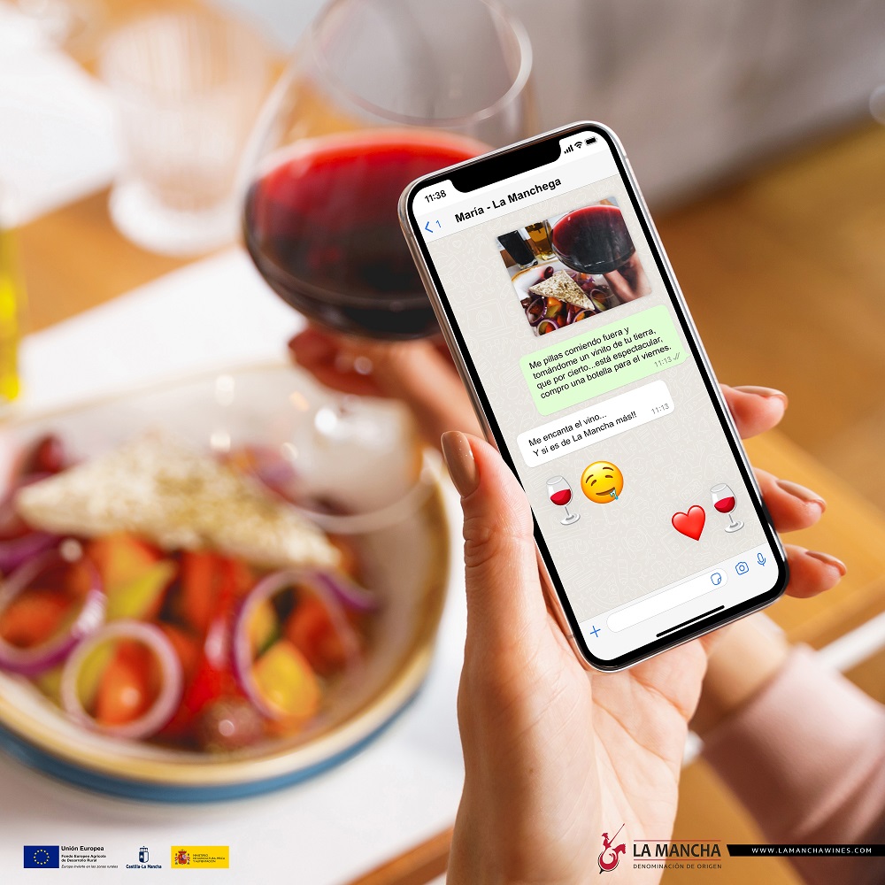 Young lady taking picture of food and wine with smartphone