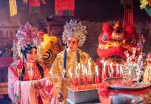 Chinese opera actor Light candle pray to god for prosperity on the occasion of the Chinese New Year