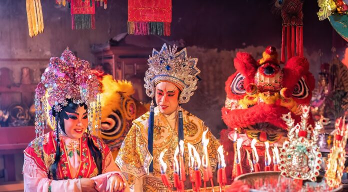 Chinese opera actor Light candle pray to god for prosperity on the occasion of the Chinese New Year