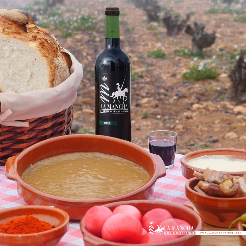 Imagen de unas gachas junto a un tinto de La Mancha